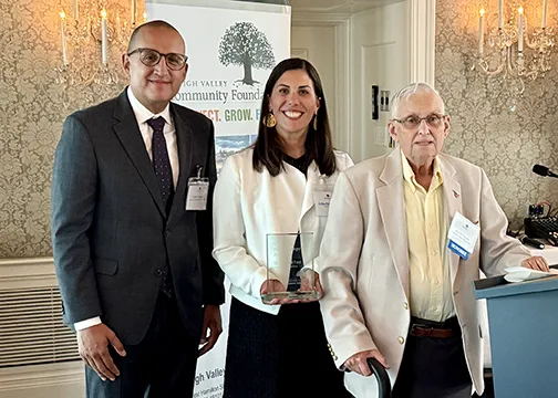 Luis Campos, Chair, Board of Governors (L.), Erika Riddle Petrozelli, President and CEO, David Torrey (r.)